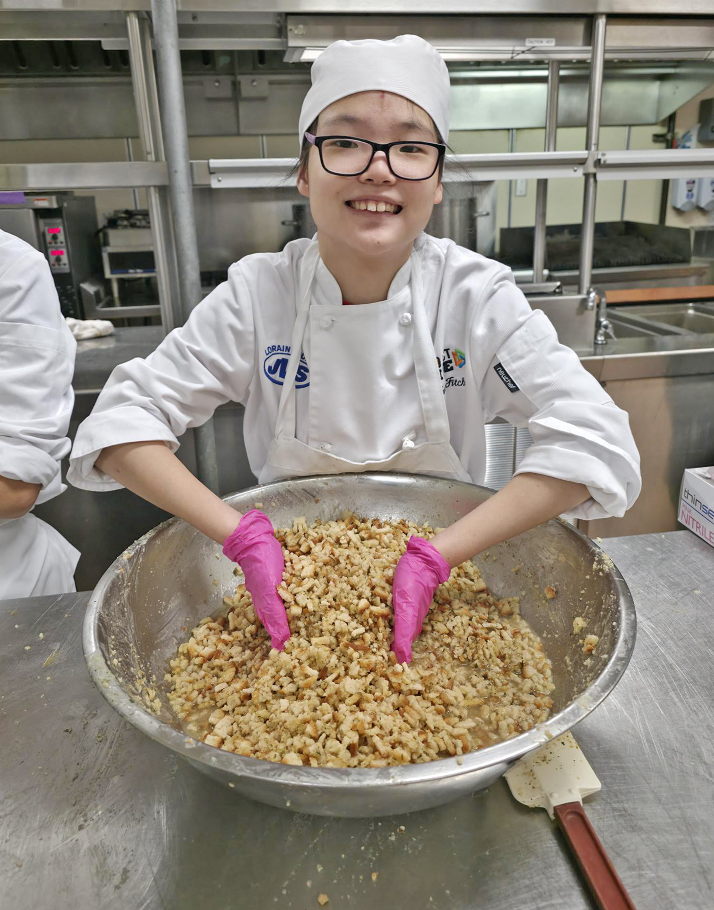 female student mixes stuffing